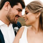 A groom and bride flashing the perfect wedding day smile